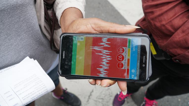 Visual of a smartphone representing an air quality data graph