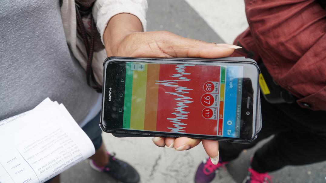 Visual of a smartphone representing an air quality data graph